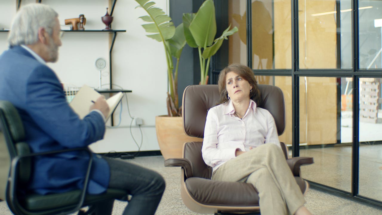 Mastering the First Impression: Your intriguing post title goes here Therapist and client during a psychotherapy session in a modern office.